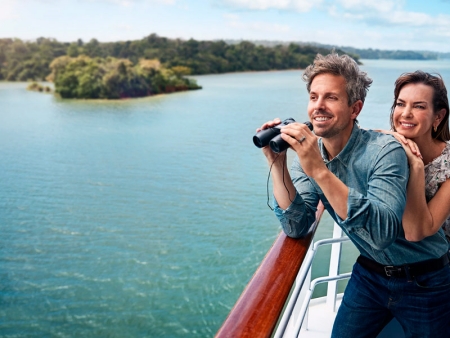 Couple with binoculars aboard Princess ship in the Panama Canal